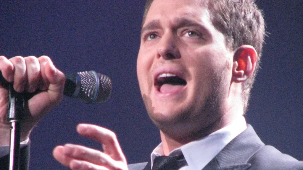 Michael Buble singing into a microphone