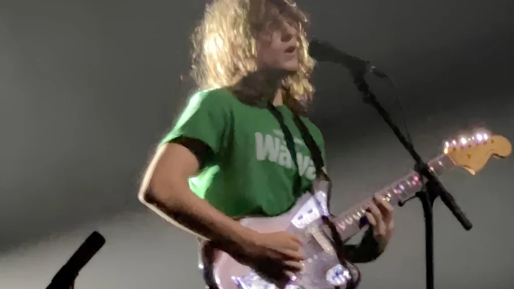 Mk.gee performing live with a Fender guitar